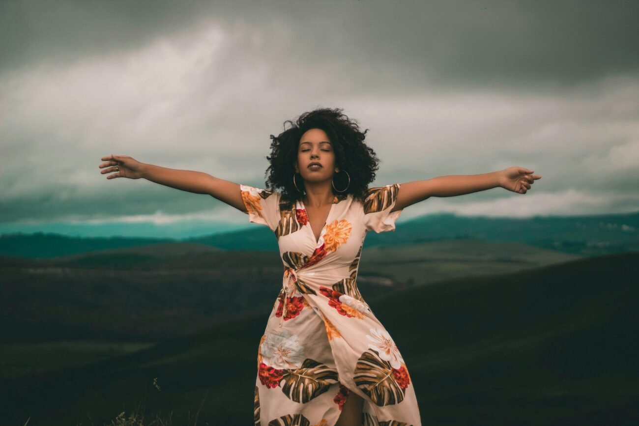 Woman feeling her feelings in nature looking relaxed